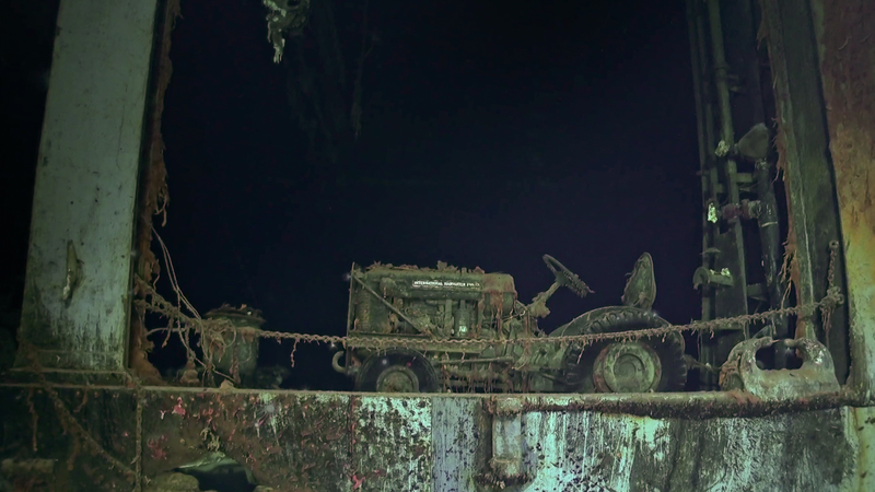 An International Harvester aircraft tug still resting upright on the ship.